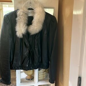 Vintage black leather jacket with faux fur around neck, not removable.